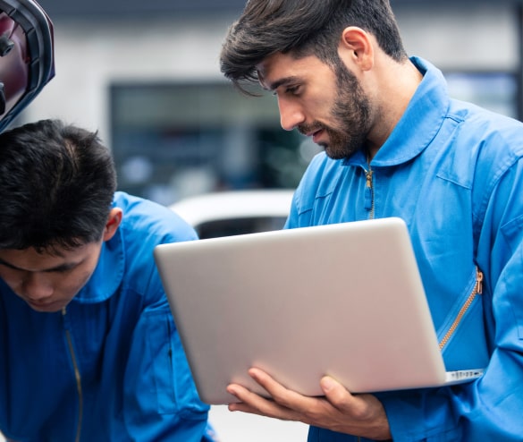 Auto body estimator reviewing insurance paperwork for a damaged car in Philadelphia